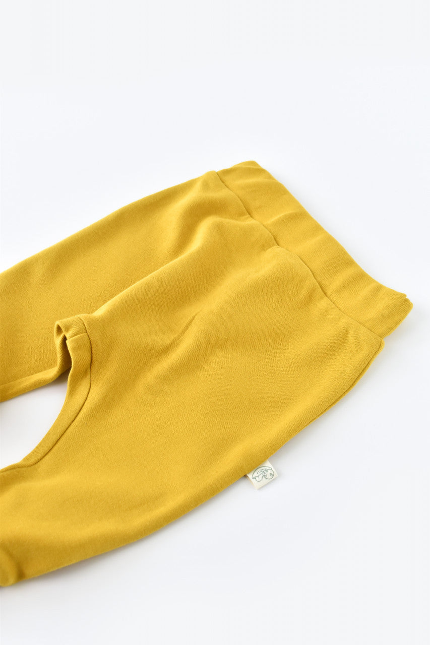 Pantaloni Bebe Unisex din bumbac organic Galben
